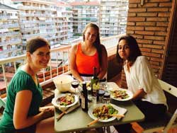 Alexandra &amp; friends enjoying a homemade meal on their balcony in Barcelona