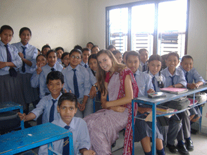 Leah in teacher's uniform with one of her classes