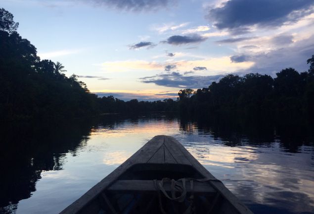 canoeing the Amazon at sunset