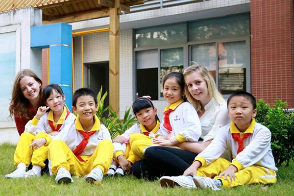 Angela with another foreign teacher and her students.