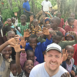 guy selfie with kids in kenya