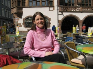 woman smiling at a cafe