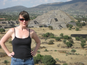 woman in mexico next to mayan ruins