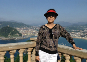 woman smiling in spain by the water