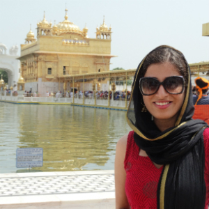 woman smiling at landmark in india
