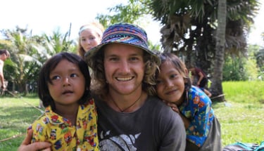 guy smiling with kids