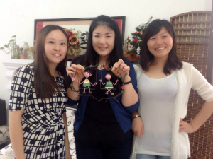 three woman smiling at school