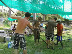 Volunteers working hard on article reef construction. article reef construction