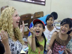 Playing a hand clapping memory game in Ubud