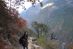 A women standing in front of beautiful scenery.