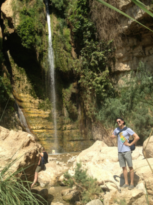 man at David Waterfall at Ein Gedi in Israel