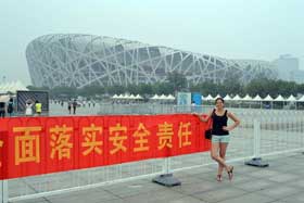 girl in front of bird's nest