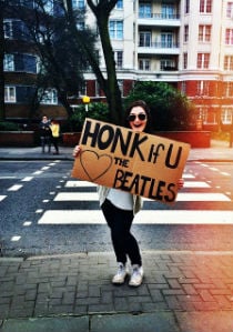 A young woman standing on the street.