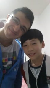 Two boys posing for a picture