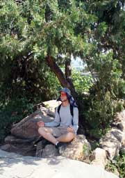 man meditating in park