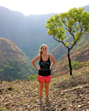 girl hiking and smiling