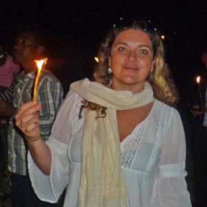 woman smiling holding a fire stick