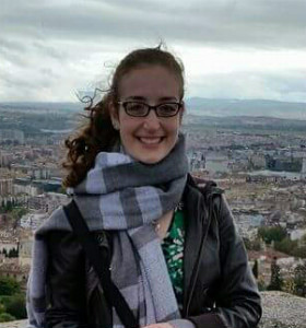 A women standing in front of a city