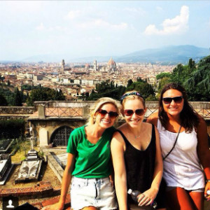 A group of people posing together for a picture in front of Florence