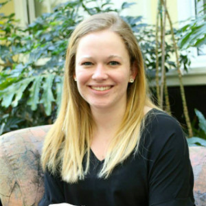 A young girl smiling.