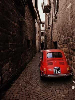 red car in alley