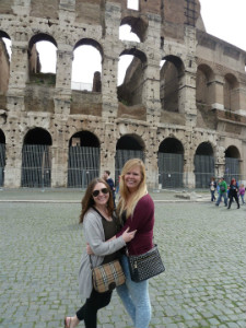 Smiling in front of the Colosseum