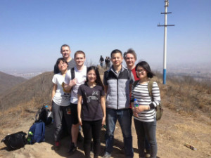 A group of young students gathered together on a mountain