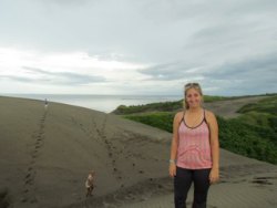 Kara climbing sand dunes in Fiji.