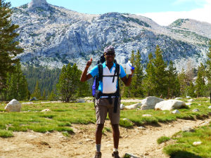 student backpacking in sierra mountains 