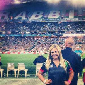 intern on sidelines rugby field