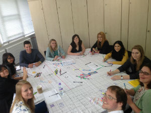 student sitting around table discussing british film