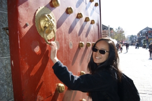 girl by wall with gold embellishments