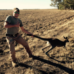Jake capturing a 'roo that just wasn't quick enough. Don't worry -- no animals were harmed in the making of this photo! man holding a kangaroo australia