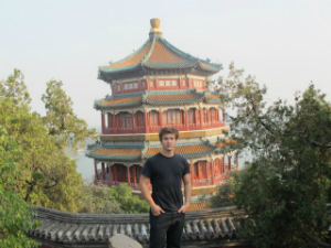 guy in china next to oriental building