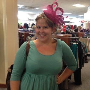 woman posing wearing a hat