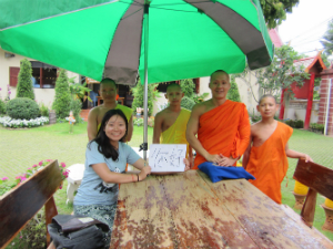 girl smiling with taiwanese monks