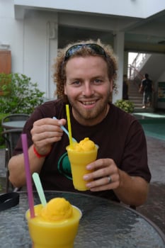 man smiling with drink