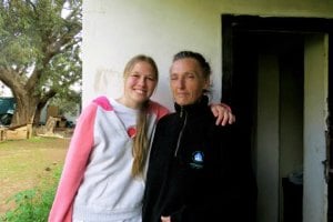 Colleen with the owner of Wenga's Farm who takes care of all the cats.