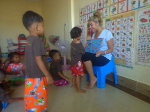 Lacey teaching English to the class.