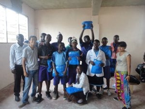 Me and a fellow volunteer, with students who worked on a malaria presentation