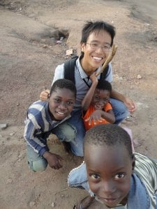 Jacky with kids near the volunteer house