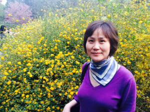 woman smiling in flower field