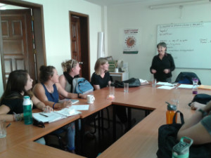 A picture of Martha teaching. A group of students gathered.