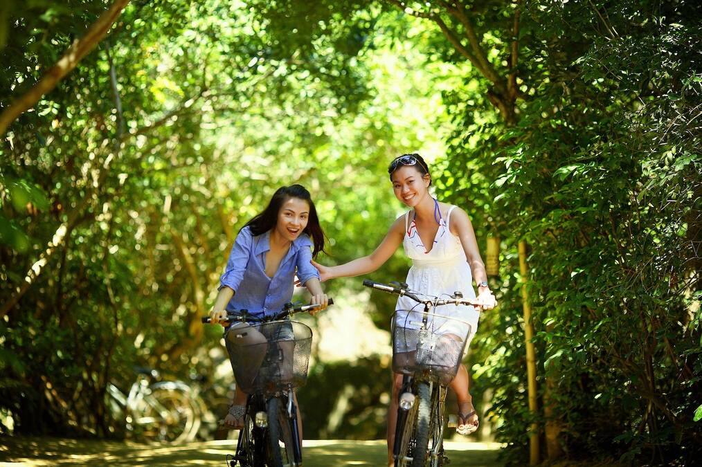 Teaching Abroad with a Family: Woman and Daughter Riding Bikes