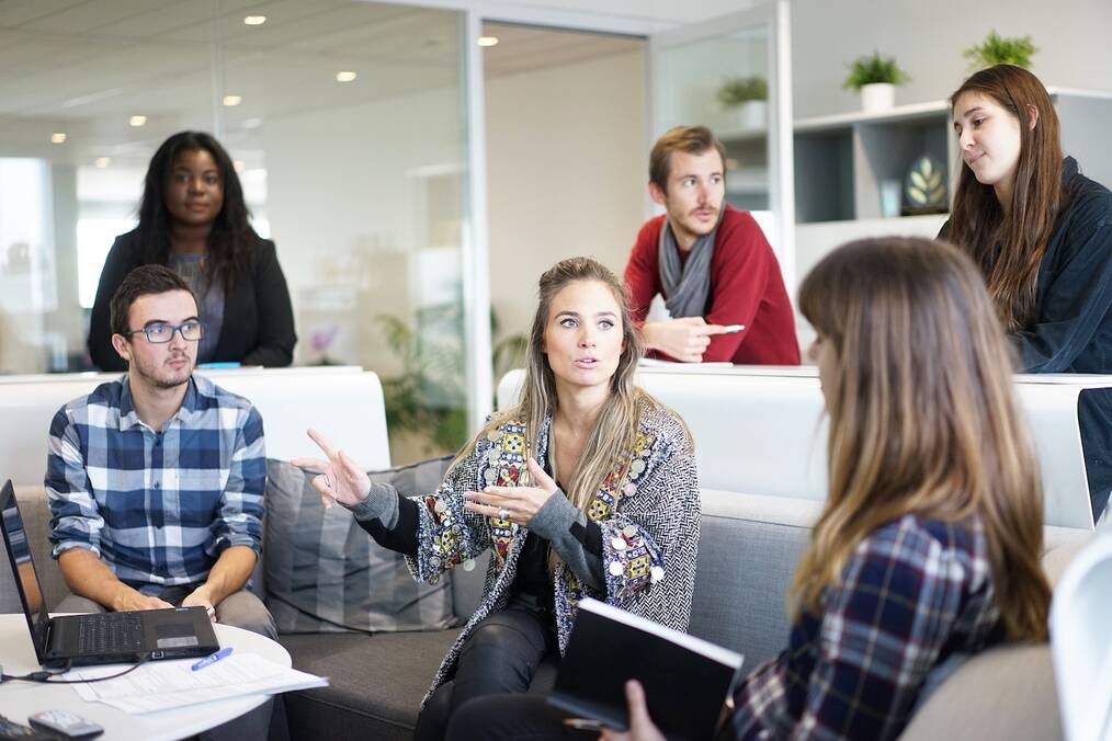 Working in a Foreign Language - Woman Talking to Group