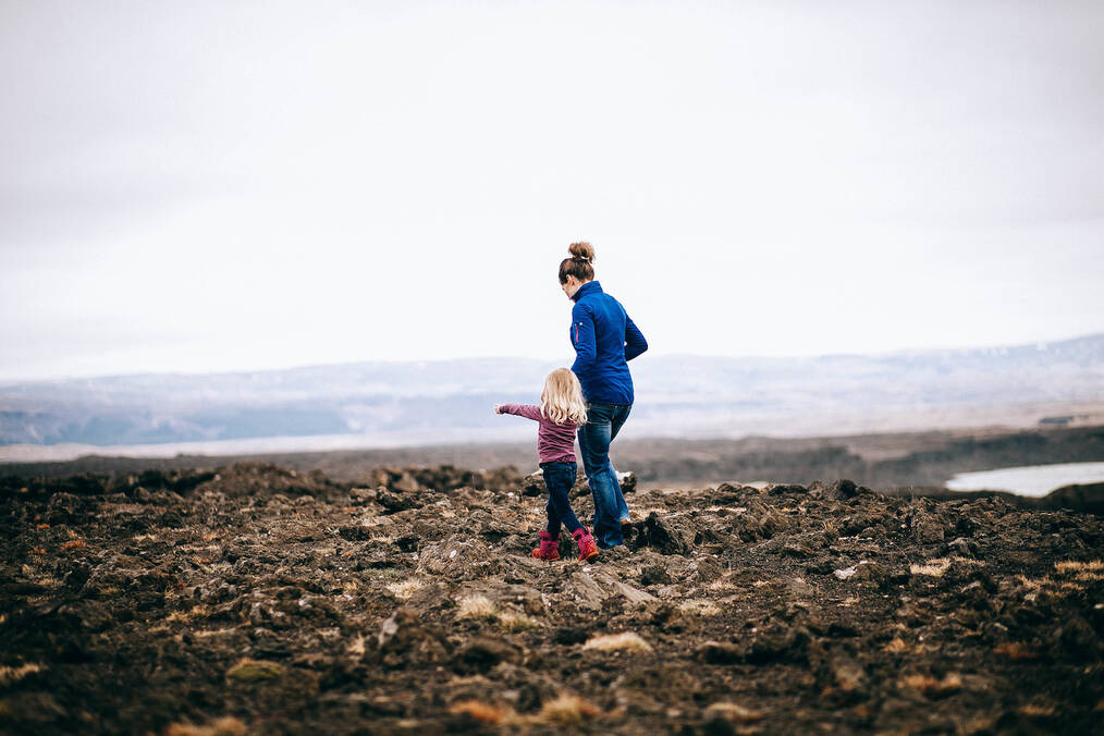 Au Pair in Iceland - Woman walking with child