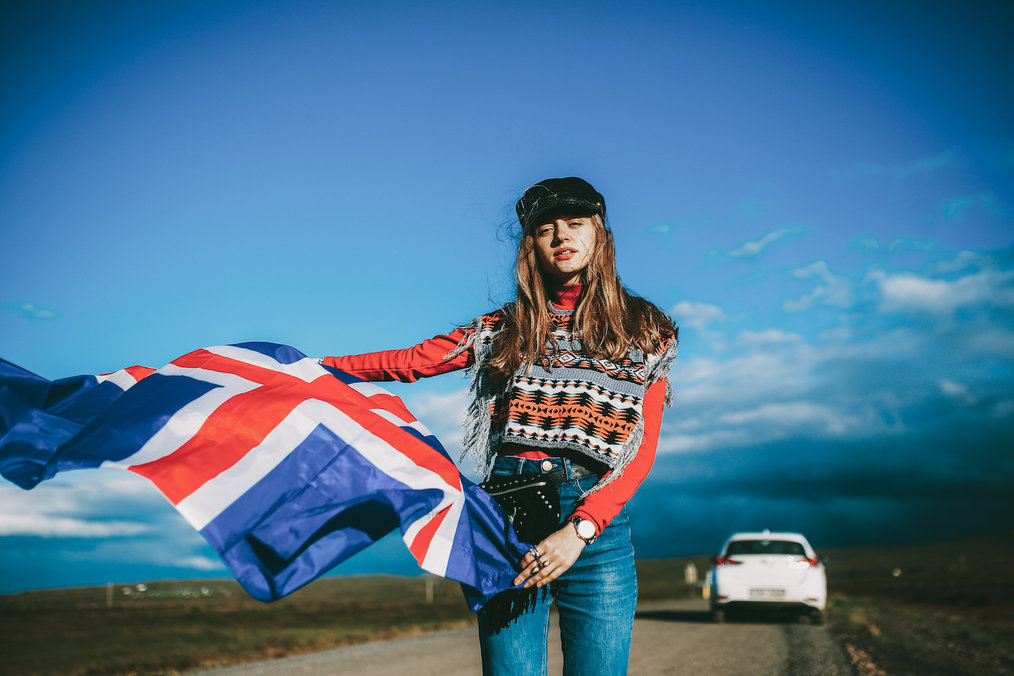 Au Pair in Iceland - Woman Holding Icelandic Flag
