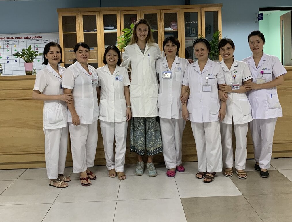 Internships in Vietnam with Projects Abroad Eight women in scrubs standing in a hospital.