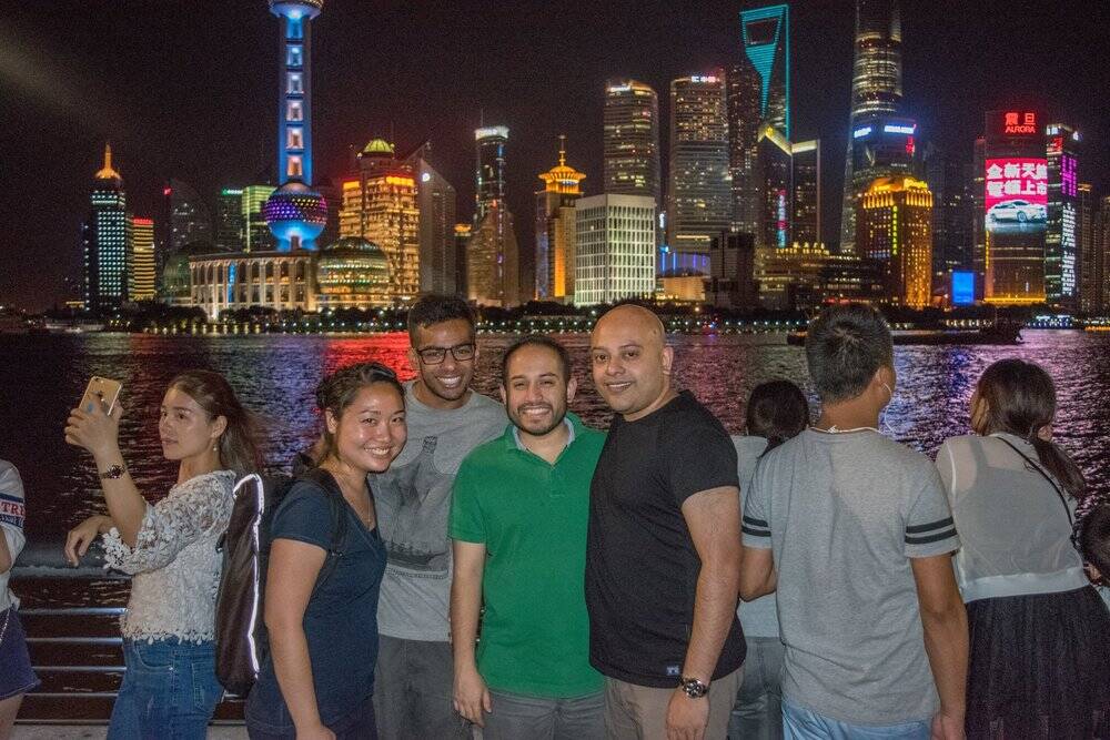 Group of interns posing in downtown Shanghai.