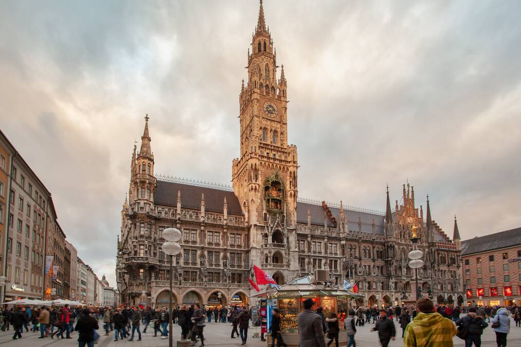 An ornate building and crowds of people in Munich, Germany.
